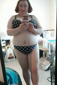 gigantic beautiful girl gobbling her dildo with a nasty grin