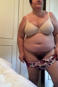 plump dame in sensual lingerie posing provocatively