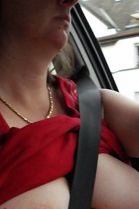 sensuous girl caressing her huge breasts seductively