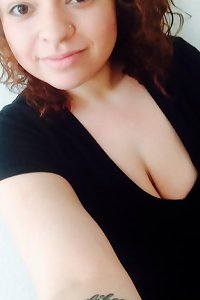 voluptuous light-haired seductively munching her luscious lips